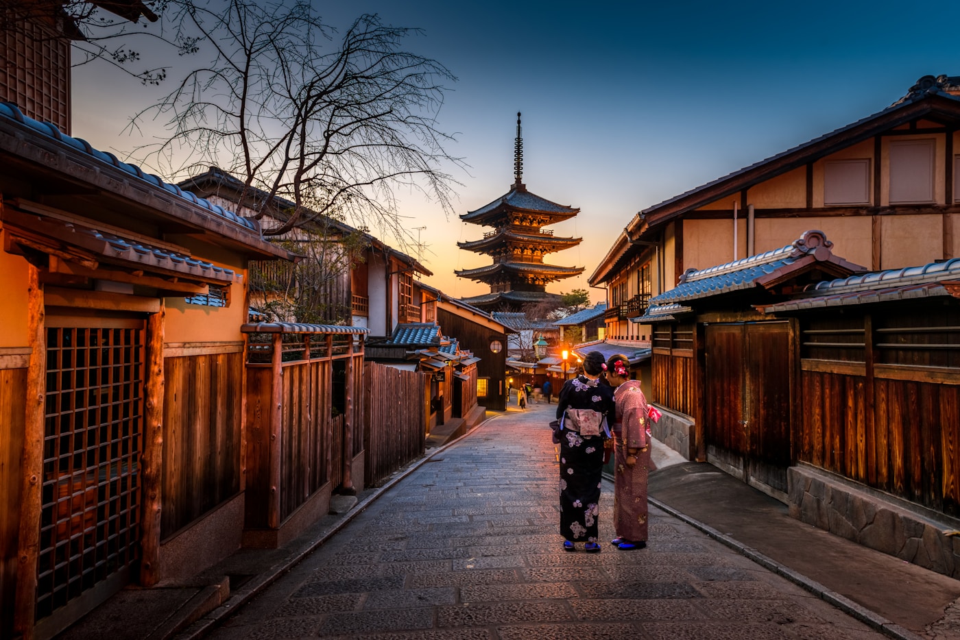 A traditional Kyoto street glowing with lantern light